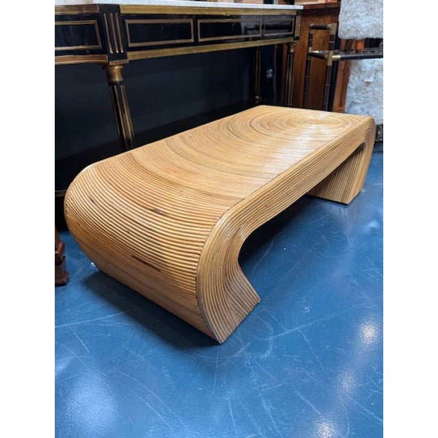 The Vintage Pencil Reed Coffee Table is a unique and stylish piece of furniture. The intricate pencil reed design serves...