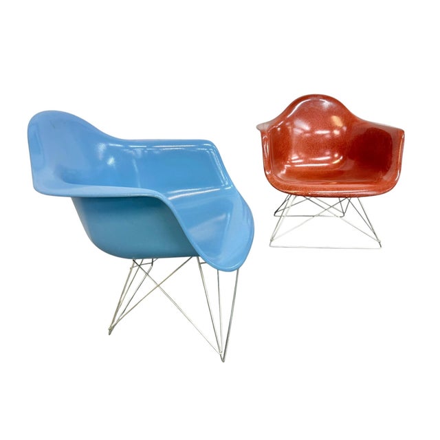 Add a vibrant touch of Mid-Century Modern style to your space with this striking pair of vintage Modernica fiberglass...