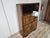 An elegant Austrian display cabinet from the 1930s, featuring a refined Central European Art Deco style and a spectacular,...