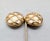 1970s or 1980s matte goldtone round domed "caged" white cabochon rhinestone clip earrings. Marked "U.C. Ugo Correani" on...