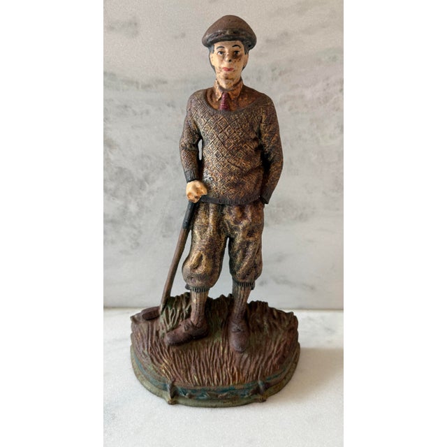 Vintage cast iron door stop in the shape of an old fashioned male golfer. Lots of good rust, dirt and patina on this one,...