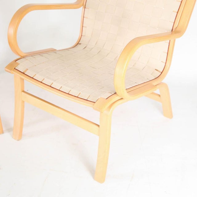 Pair of Scandinavian vintage wooden and fabric armchairs. Comfortable, timeless design and great condition!