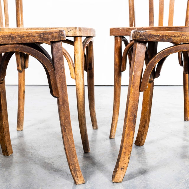 1950’s Classic Bistro Square Edge Bentwood Dining Chairs. The process of steam bending beech to create elegant chairs was...