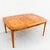 Restored mid century modern dining table in solid walnut and bookmatched olive ash burl by Maurice Bailey, produced by Cal...