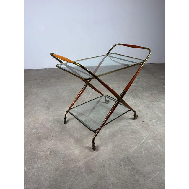 Mid-century bar cart in rosewood and brass, crafted in the style of Cesare Lacca, 1950s. A beautiful combination of brass...