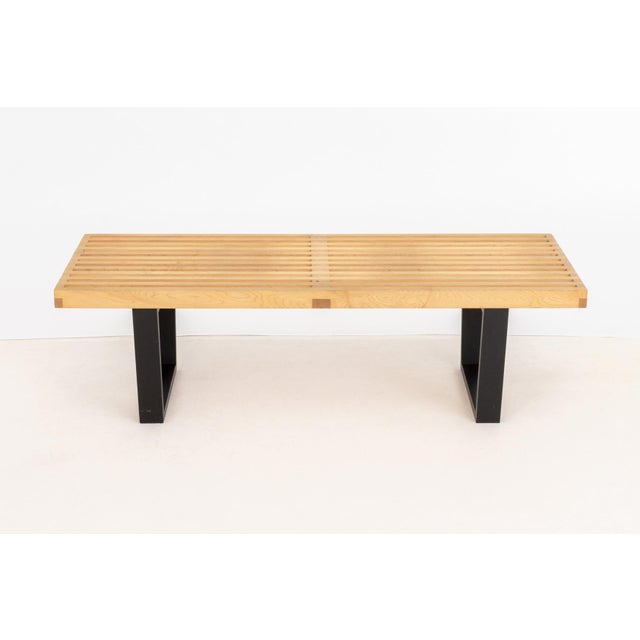 George Nelson for Herman Miller Slat Bench, model 4690, maple slats on ebonized base, label to underside. 14" H x 48" W x...