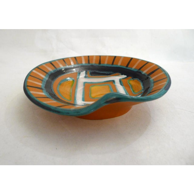 Small mid-century round dish/trinket tray with a slight fold on the rim, creating a wavy effect. Geometric/graphic...