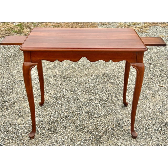 Classic Cherry Queen Anne style tea table. Nicely molded too above a scalloped apron, standing proud on graceful carved...