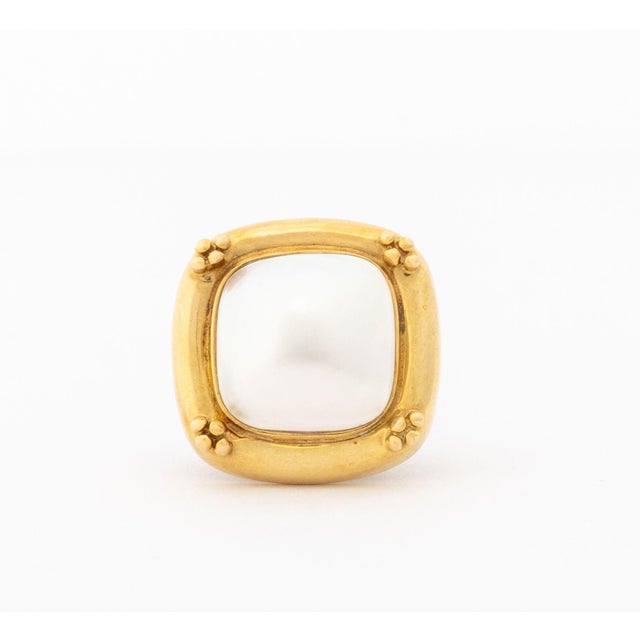 Mabe Pearl and 14K Yellow Gold Pendant Enhancer, brightly polished and decorated with granulation, featuring one bezel set...