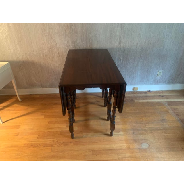 Vintage wooden Dining Table. The table is in nearly pristine condition with almost no blemishes. Some writing on the...