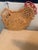 Wicker hen with 4 round small mats that fit inside the chickens pouch Very cute