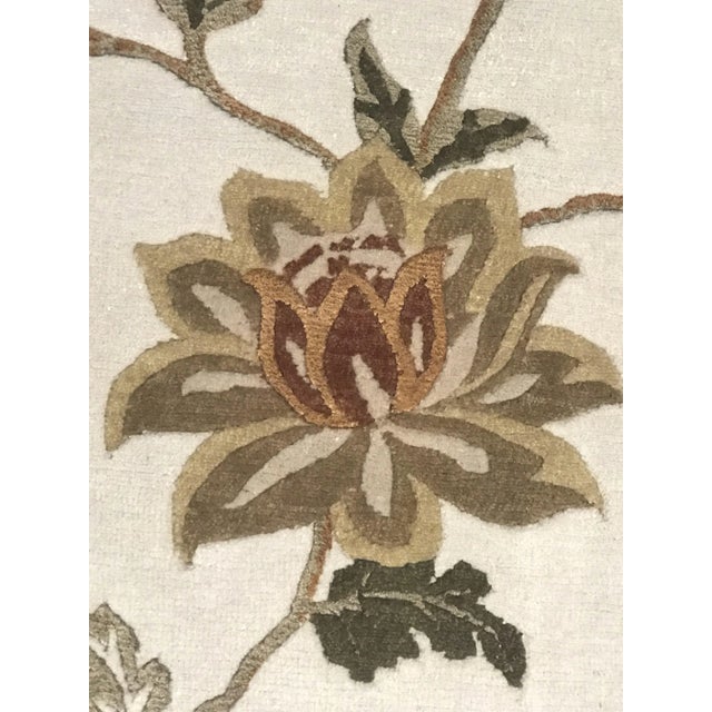 This vintage rug was handcrafted in India.