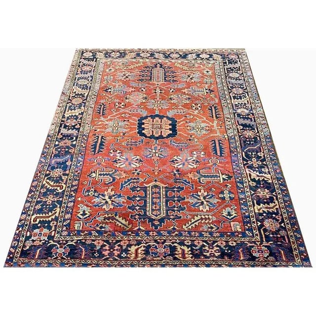 ACTUAL SIZE: 8’1″ x 11’3″ PRIMARY COLOR: Rust / Navy AGE: Antique MATERIALS: Wool FOUNDATION: Cotton PRODUCTION:...