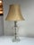 Design Plus Gallery presents a Vintage Cut Glass Table Lamp. The cut glass table lamp has an etched clear glass body,...