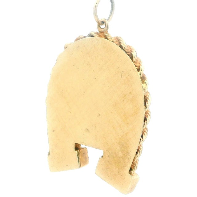 This antique Victorian locket pendant (c.1880s) is shaped as a horseshoe, symbolizing luck and protection. Crafted in 14K...