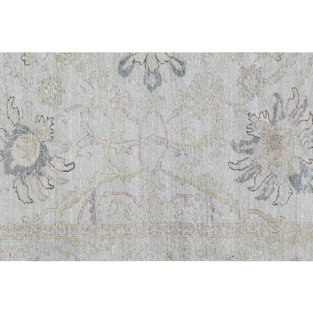 Crafted in the Nile delta region of Northern Egypt, the Vintage Egyptian Tabriz Rug is skillfully handwoven with wool on a...