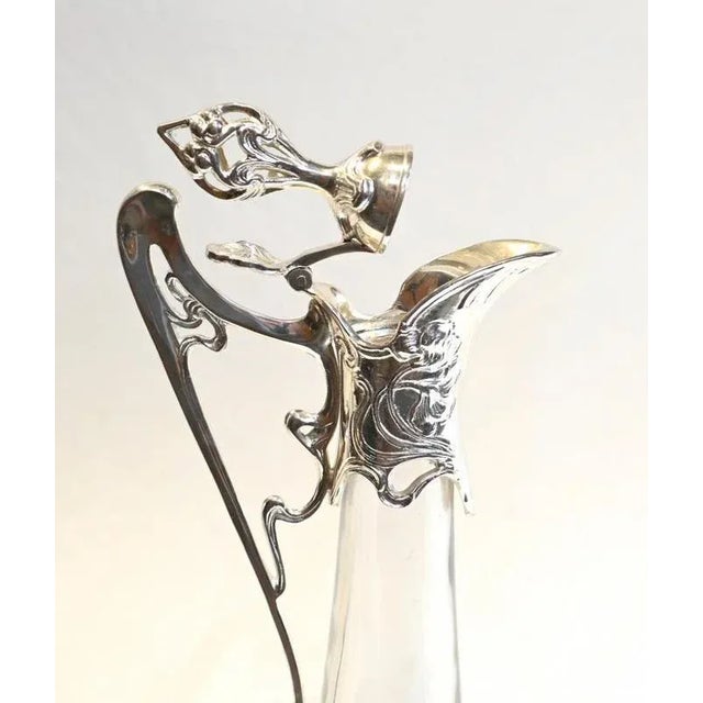 You are viewing a gorgeous glass and silver plate claret jug in the art nouveau manner. Offered in great shape ready for...