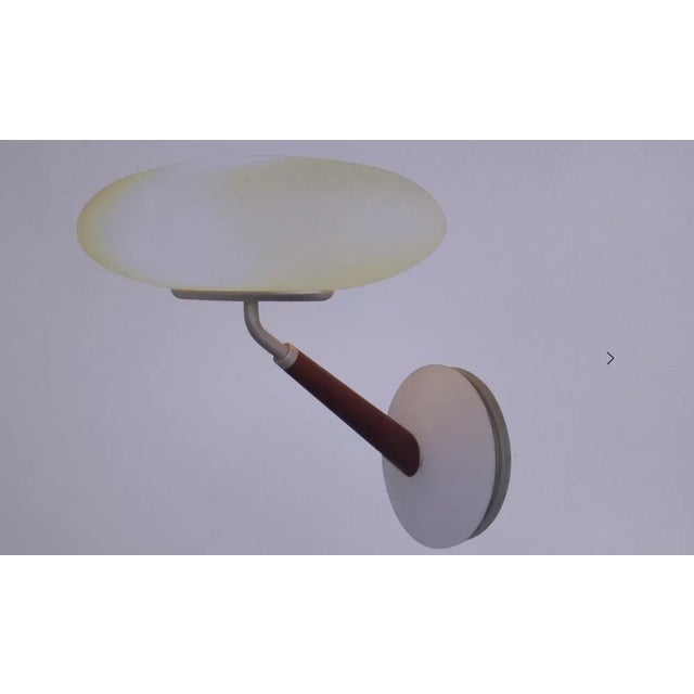 The material combination made of glass (matted) and wood distinguish this elegant lamp. The cherry wood shaft harmonizes...