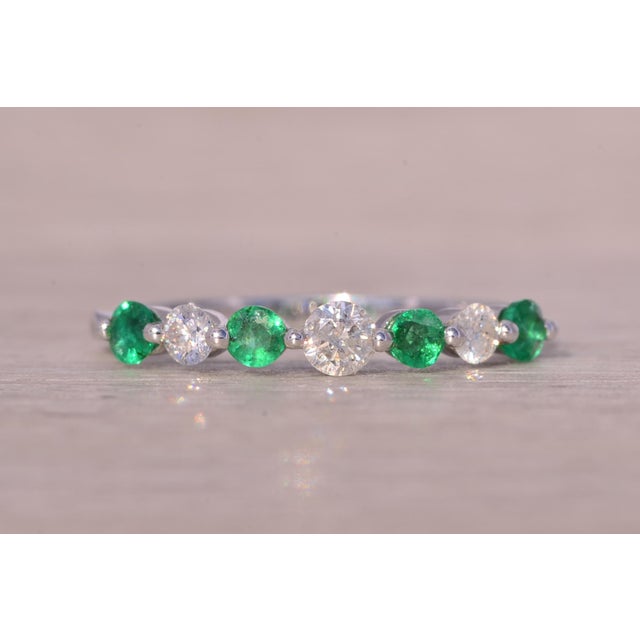 The Chi: Single Prong Set Natural Emerald and Diamond Band. This exquisite band showcases an alternating pattern of round...