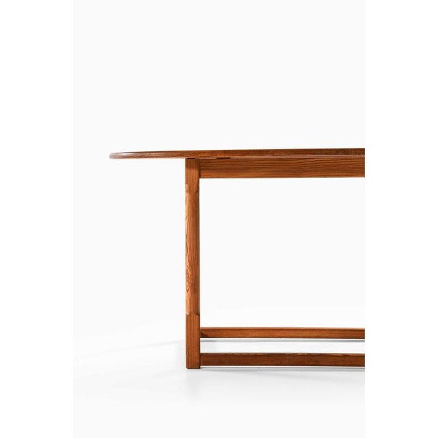 This rare console or side table, designed by carl malmsten and produced in sweden during the 1930s, exemplifies the...