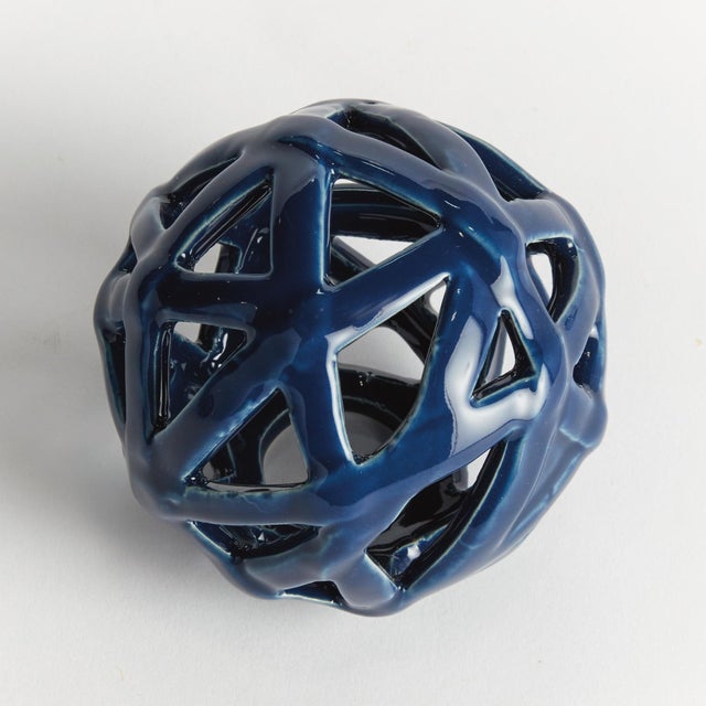 This contemporary little orb is made of thin ceramic strips, which are hand formed, and sparingly shaped into a rounded...