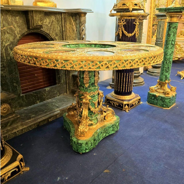Beautiful French Rococo style round pedestal dining table featuring a refined green finish that evokes sophistication and...