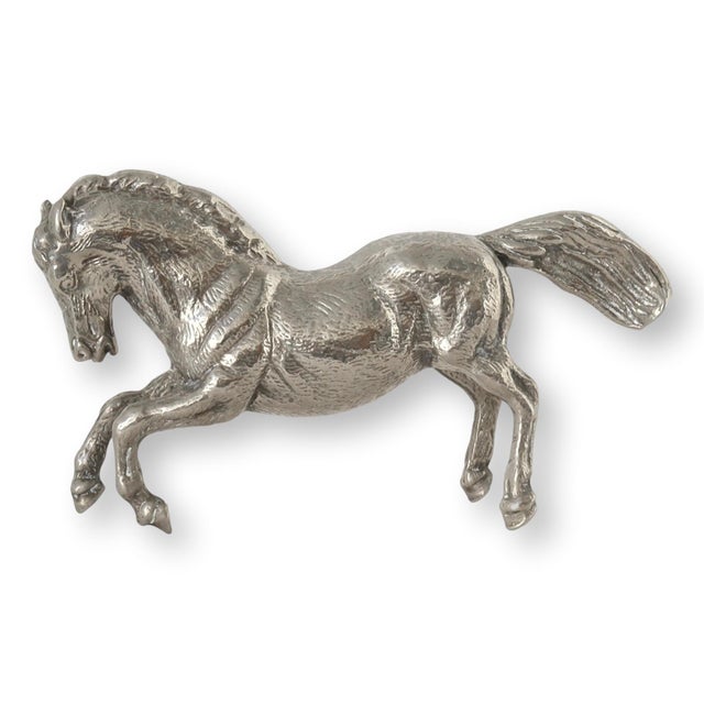 Elegant 1960s Italian silver-plated rearing horse sculpture, showcasing exquisite craftsmanship and dynamic detailing....