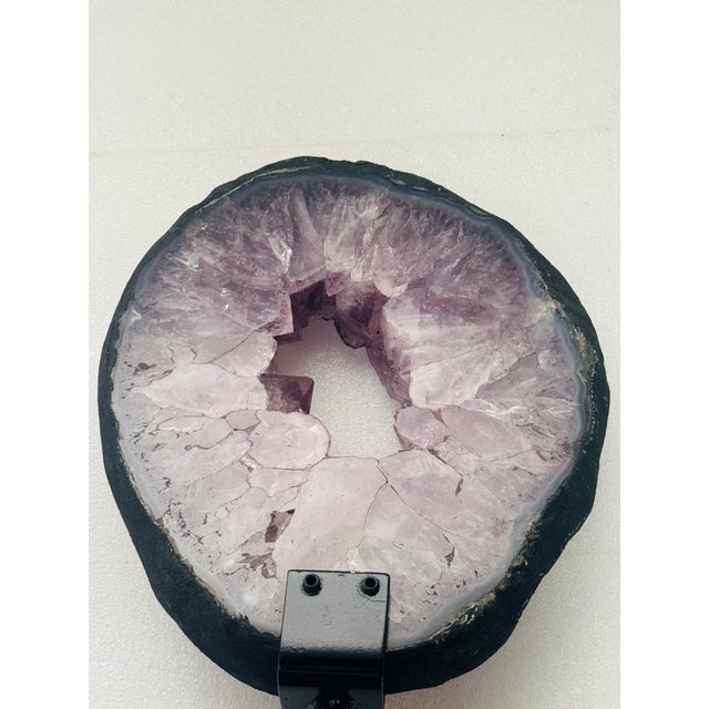 Amethyst geodes are powerful, violet-hued quartz formations renowned for radiating calming, protective, and purifying...