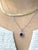 This beautiful pendant features a 1.24 carat cushion cut ruby gemstone with a halo of natural earth mined diamonds and a...