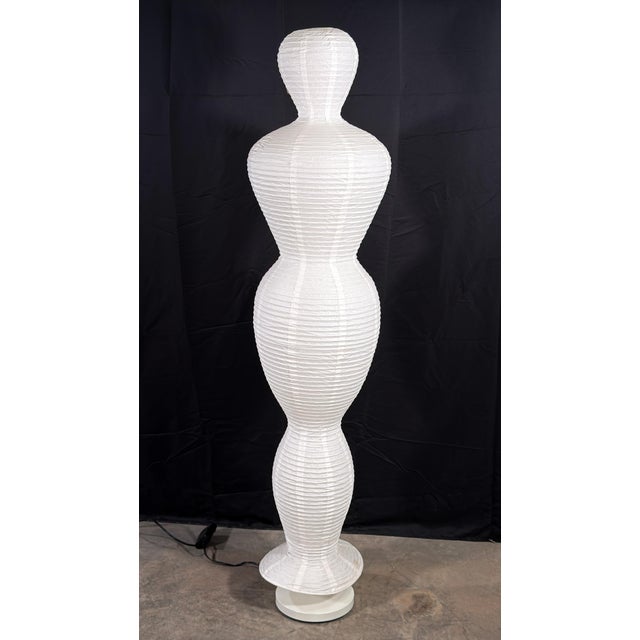 This paper and wire floor lamp from IKEA's early 2000s catalog takes the form of a stylized female figure, with stacked...