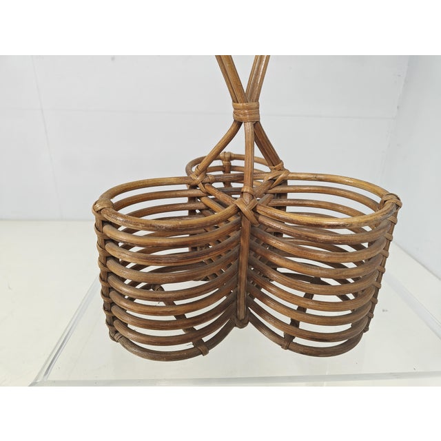 Stunning Mid-Century French Riviera style wine rack in curved rattan and hand-woven wicker. This charming and unique piece...