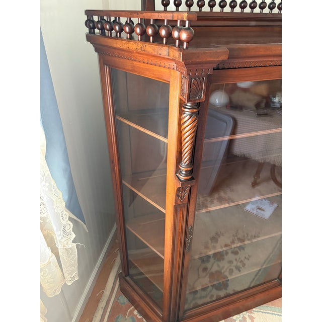 For sale is a stunning, late 19th-century Victorian Renaissance Revival glass-front display cabinet (circa 1880- 1890)....