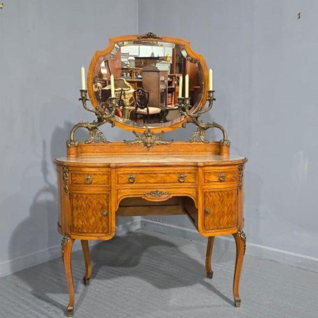 A top quality French satinwood parquetry and tulipwood inlaid dressing table, kidney shaped with serpentine front, two...