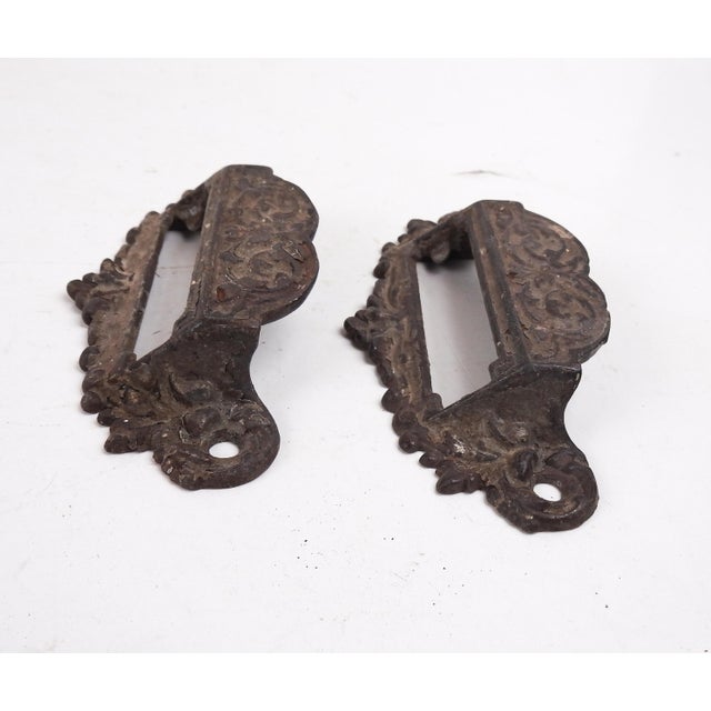 Pair of ornate cast iron apothecary drawer pulls. Window opening for glass and labels. 4" on center screw holes, overall...