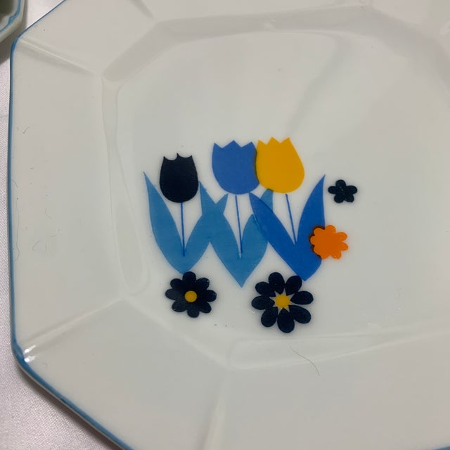 These are vintage 1970s mid-century modern "Tulip Time" octagonal plates imported from Japan by Enesco Imports.
