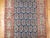 A long and narrow finely woven Persian runner featuring an all-over paisley design. Measures: 2'7'' x 15'8''.