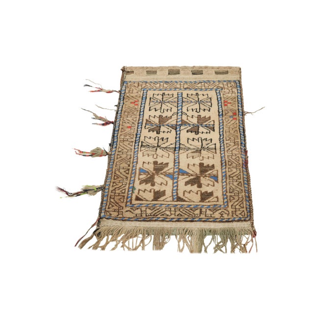 An ode to the nomadic sensibilities of Baluchistan, a 2x3 antique Baluch rug originating from Persia circa 1920-1930. The...
