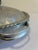 A charming vintage finds serving piece in hand wrought hammered aluminum, featuring an engraved tulip bouquet on the domed...