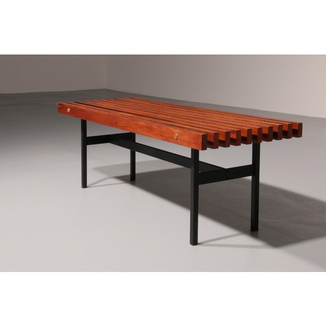 Step into the charm of the past with this beautifully preserved mid-century bench crafted from warm teak wood. More than...