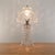 A mid-century cut crystal glass boudoir table lamp dating to circa the 1950s–1960s, combining a substantial pedestal base...