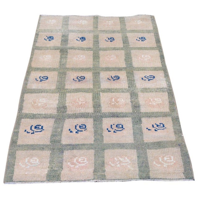 Hand-knotted with care using traditional rug-making techniques, this wool rug blends timeless craftsmanship with a modern...