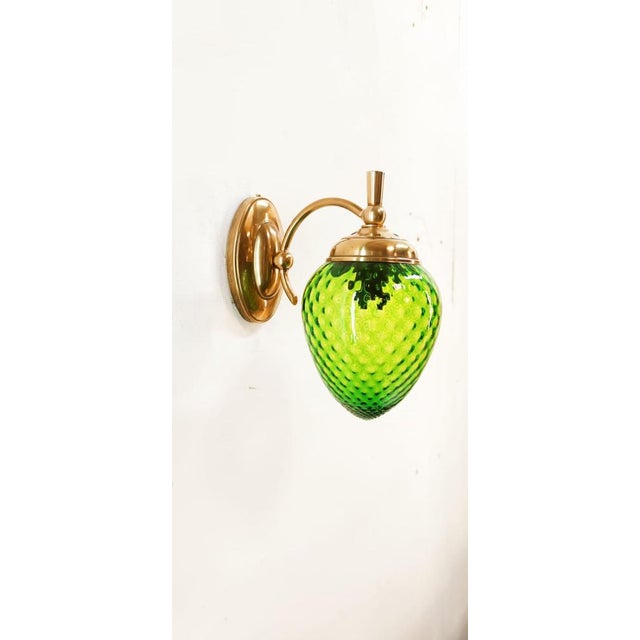 Green Glass & Brass Wall Light, in Very Good conditions. Designed 1960 to 1969 Up to 250V (Europe/UK Standard).The wiring...