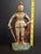 This antique cast iron figural doorstop depicts a standing knight in full suits of plate armor with a lowered visor,...