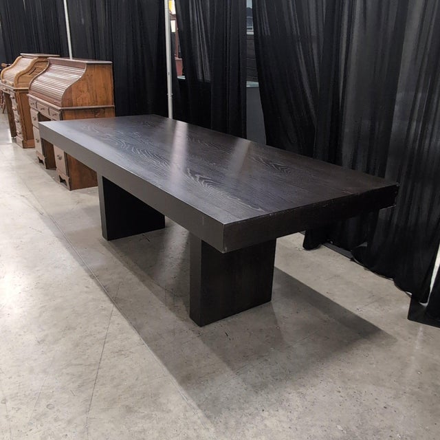 West Elm Terra dining table in the discontinued Chocolate finish, with a thick slab top of roughly 4 inches resting on two...