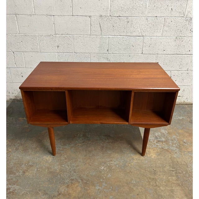 1960’s Danish teak desk with bookcase on the back part. In overall very good condition. Measurements: 29” tall 48” wide...