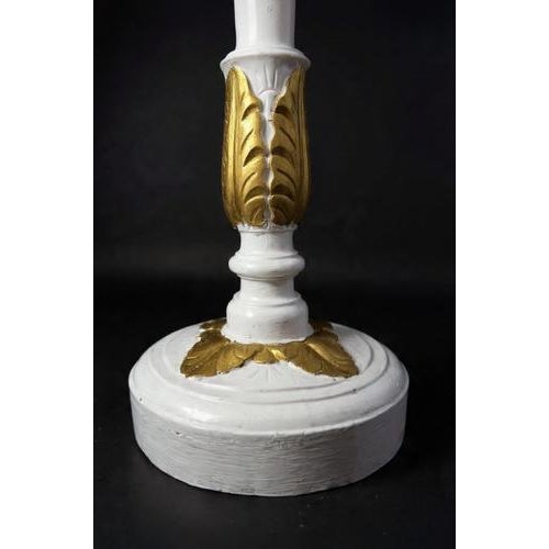 Impressive pair of large carved wooden pillars featuring a round base and capital, beautifully decorated with detailed...