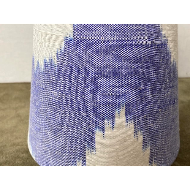 A clip top chandelier shade handmade from a hand woven ikat fabric. Measurements: top 3” side 4” bottom 4”