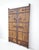 This pair of antique Chinese door panels&nbsp;showcases a blend of traditional craftsmanship through its rustic wood and...