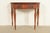 A gorgeous antique Federal, Georgian, or Regency style flip top demilune console game table In the manner of Baker...