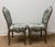 Pair of Louis XV period flat-back chairs in molded, carved and waxed beech wood. enhanced with symmetrical carvings such...